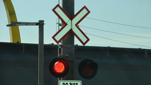 Low angle view of stop sign against sky