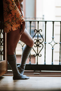 Anonymous woman relaxing on balcony