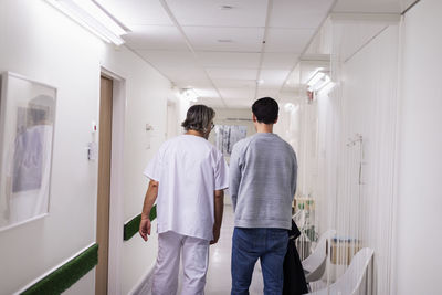 Doctor and patient in hospital corridor