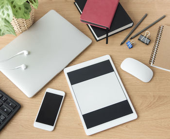 Office workplace with laptop on wooden table