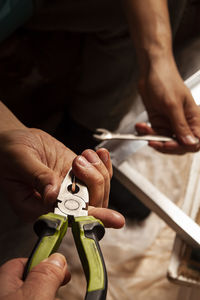 Midsection of man working at workshop