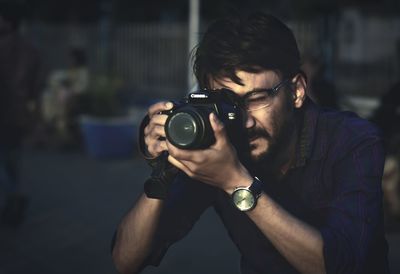 Portrait of man photographing