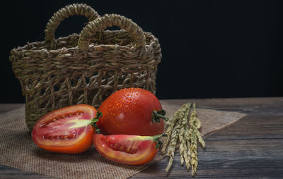 Close-up of fruits in basket on table