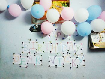 High angle view of multi colored balloons on table