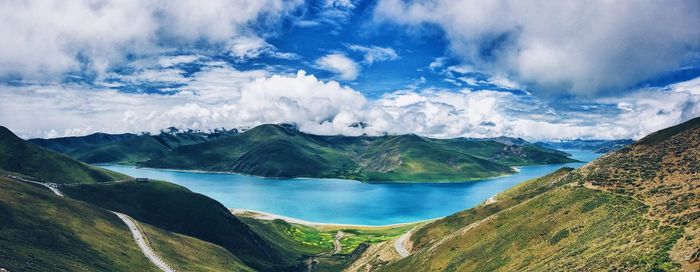 Panoramic view of landscape against cloudy sky