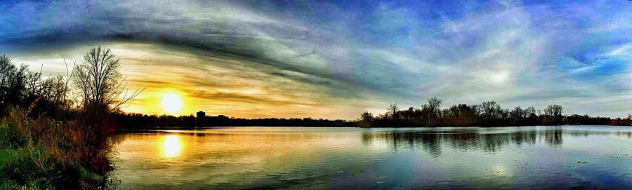 Scenic view of lake against cloudy sky