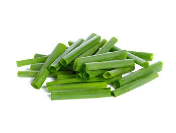 Close-up of green chili pepper against white background