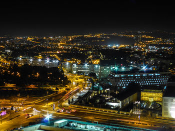 High angle view of illuminated cityscape at night