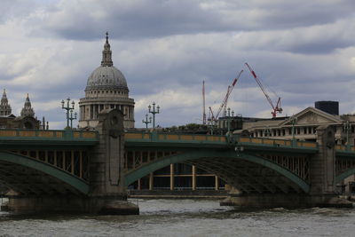 Bridge over river against sky