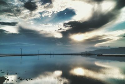 Scenic view of sea against cloudy sky