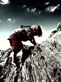 Low angle view of person against sky