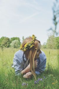 Woman on field against sky