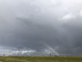 Scenic view of rainbow over field