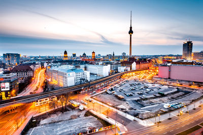 High angle view of city street and buildings at dusk