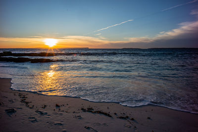 Scenic view of sea against sky during sunset