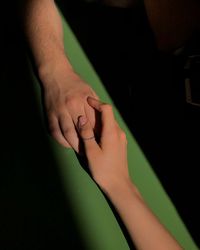 High angle view of couple holding hands