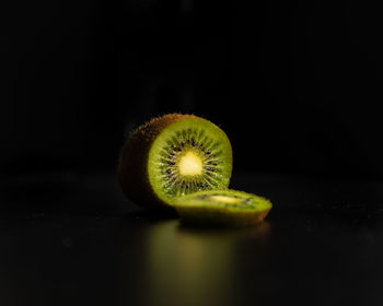 Close-up of lemon slice over black background