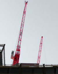 Low angle view of crane at construction site