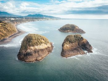 Rocks on shore against sea