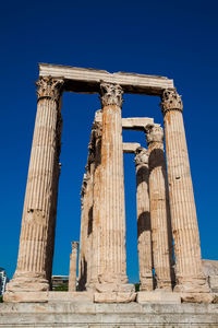 Ruins of the temple of olympian zeus also known as the olympieion and the acropolis in athens 