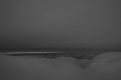 Scenic view of snow covered landscape against clear sky