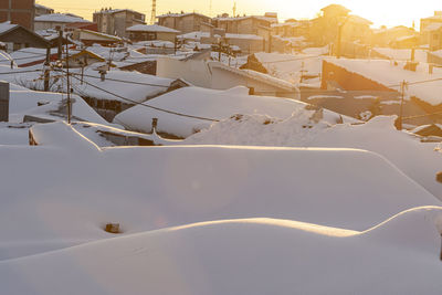 High angle view of houses in city during winter