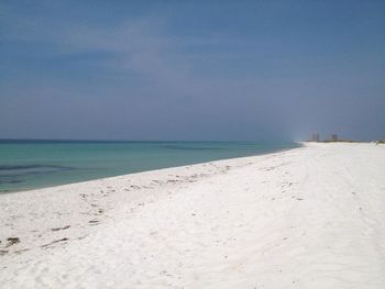 Scenic view of beach against clear sky