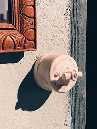 Closeup view of wall with electrical switch, light and shadow with copy space 