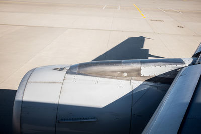 Close-up side view of a cropped airplane