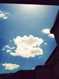 High section of building against blue sky