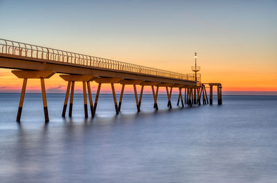 The sea pier of badalona in spain before sunrise