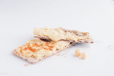 Close-up of cake against white background