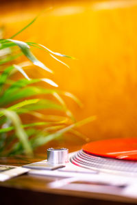 Close-up of lit tea light candle on table