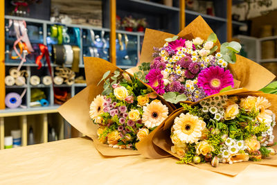 Midsection of woman with bouquet