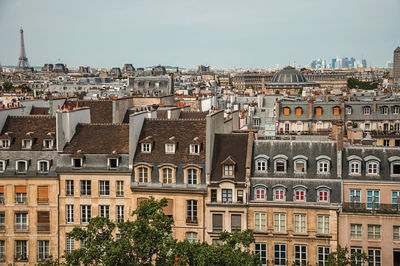 Buildings in city against sky