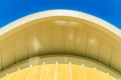 Low angle view of illuminated building against sky