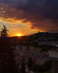 High angle view of buildings against sky during sunset