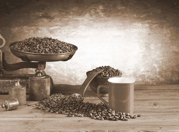 Coffee beans on table against wall