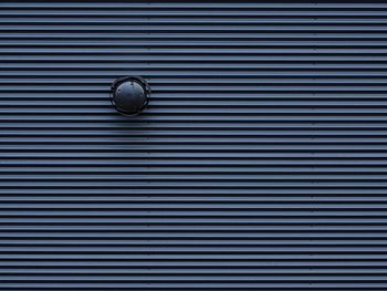Full frame shot of electric lamp on wall