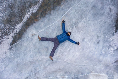 High angle view of man with umbrella in winter