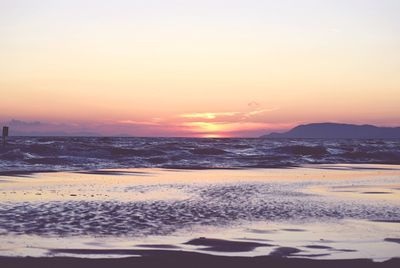 Dramatic sky over sea during sunset