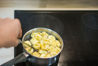 Cropped hand holding food