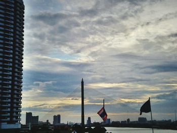 City skyline against cloudy sky