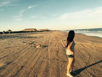 Rear view of woman on beach