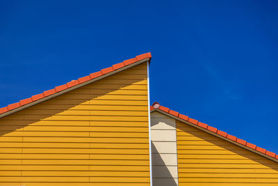 Low angle view of steps against clear blue sky