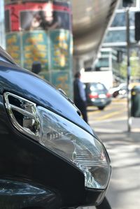 Close-up of car on street