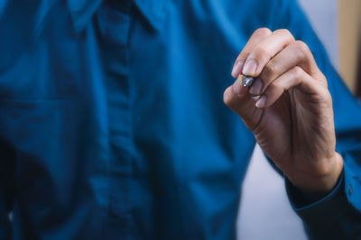 Midsection of woman holding hands