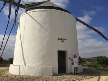 White image of water tower against sky