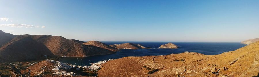 Panoramic view of sea and rocks against sky