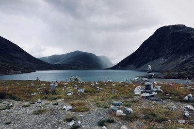 Scenic view of lake and mountains against sky